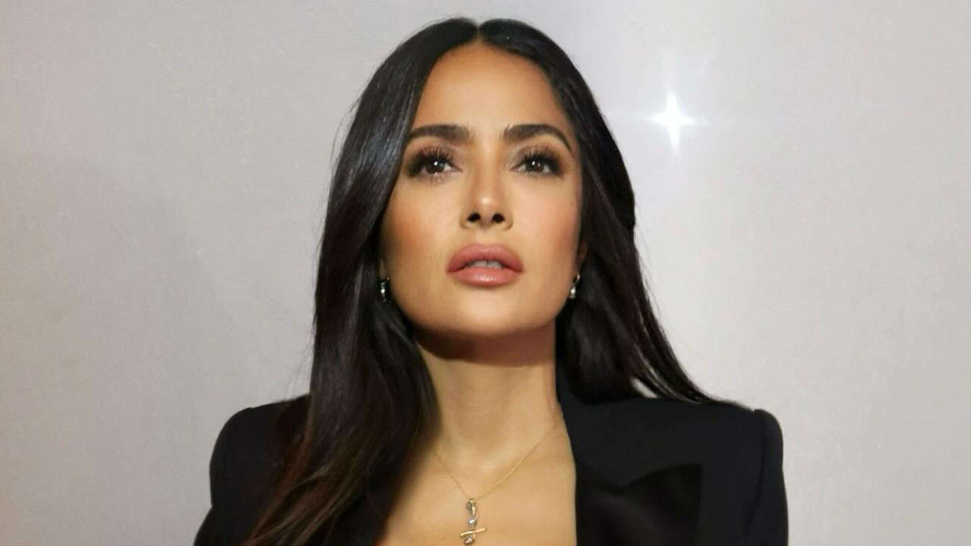 Salma Hayek, 57, nearly suffers wardrobe malfunction in tight blazer for fashion show as fans praise ‘stunning’ star