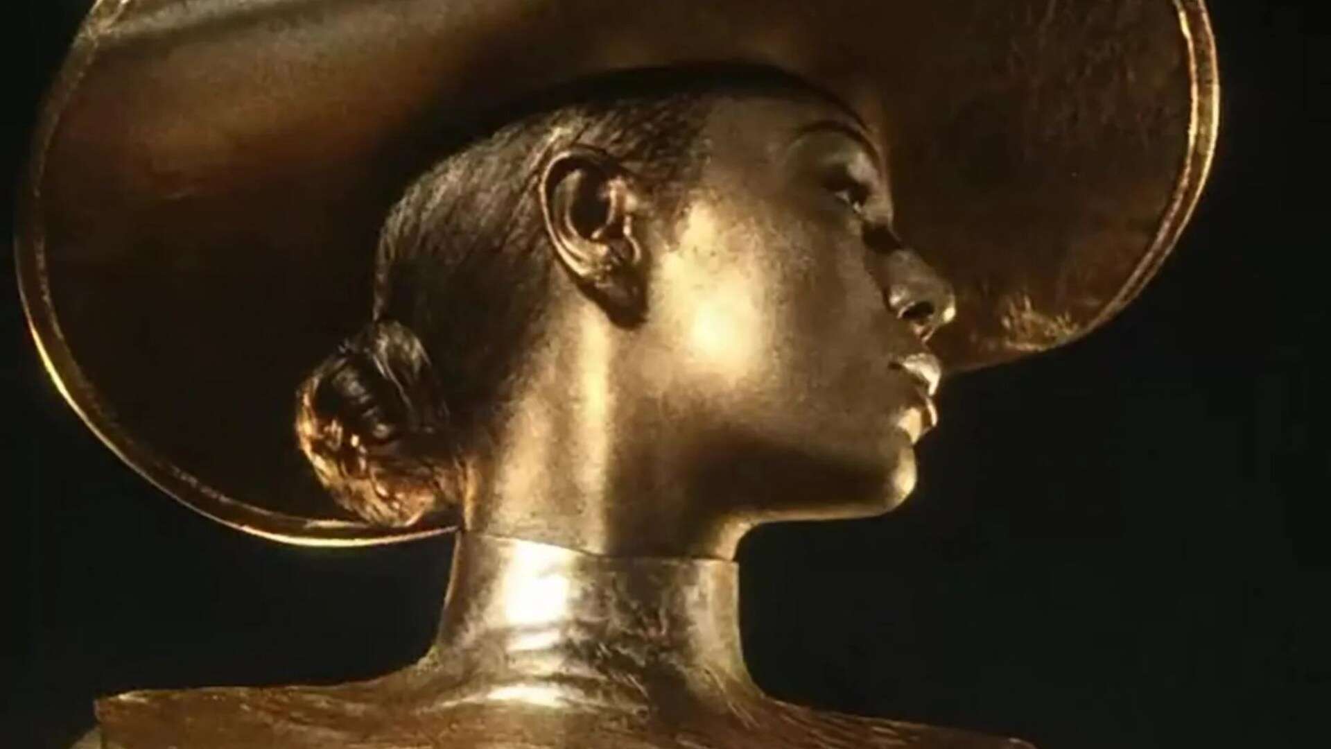 Beyonce sizzles as she’s painted in gold in raunchy perfume advert pictures