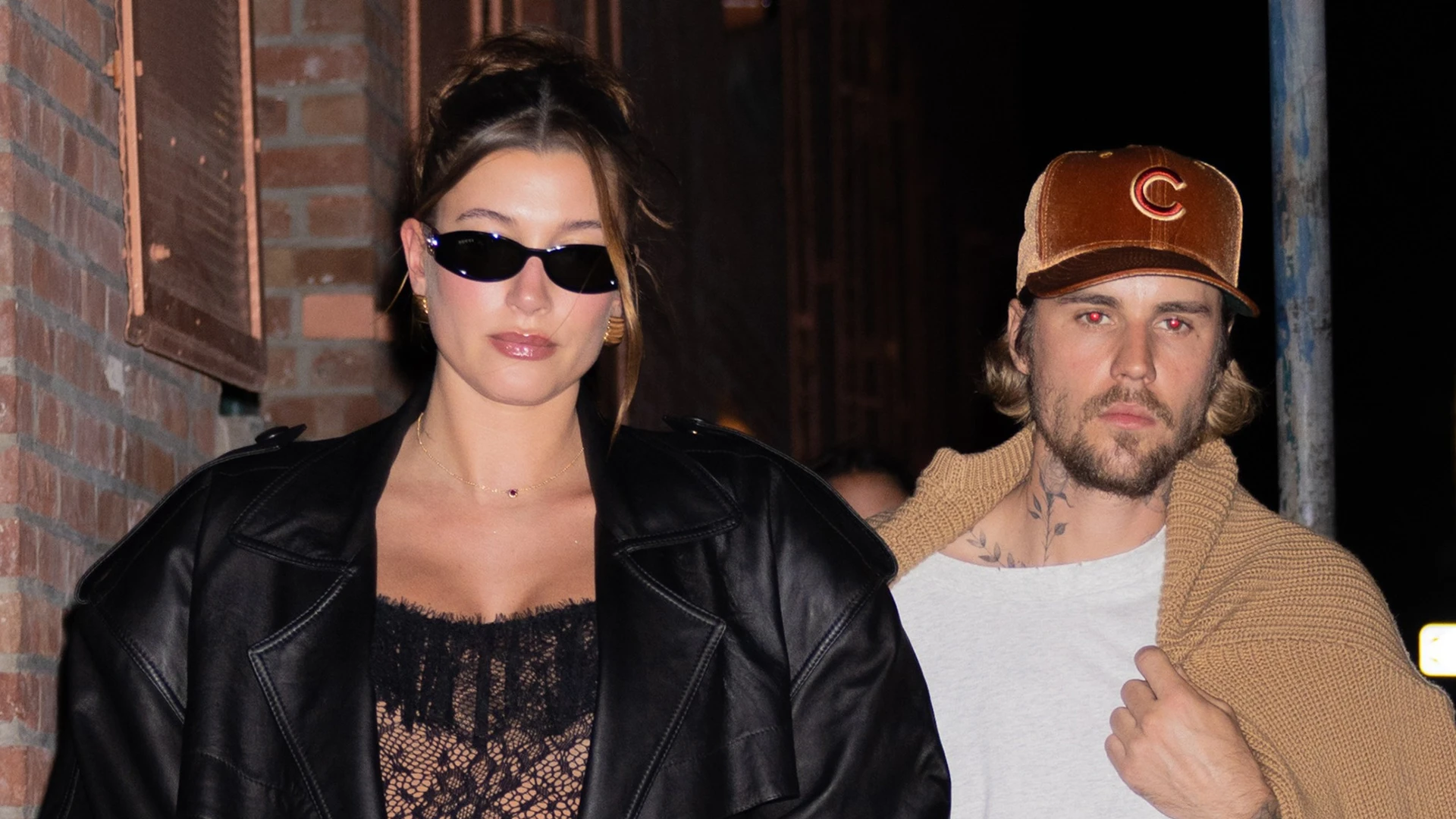 Pregnant Hailey Bieber stuns in tight nude lace catsuit and heels while Justin wears baggy shorts & sweater on NYC date