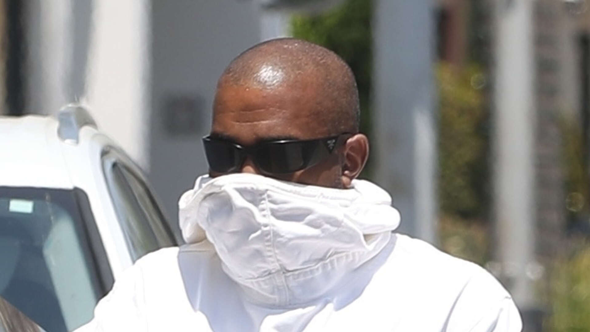 Kanye West hides his face with jacket and sunglasses during Los Angeles outing after lawsuit drama and Yeezy shutdown