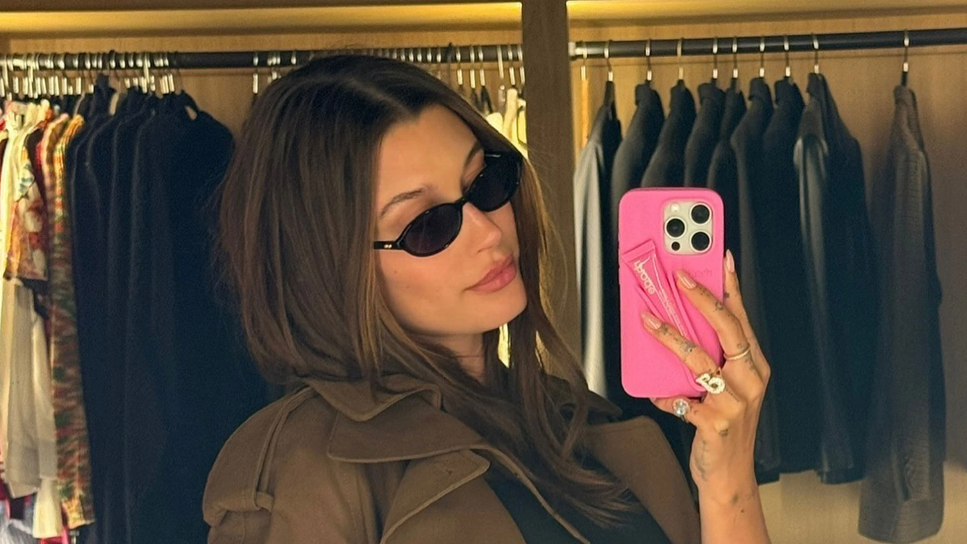 Hailey Bieber’s growing baby bump pops out of tight black romper on shopping trip as she expects first child with Justin