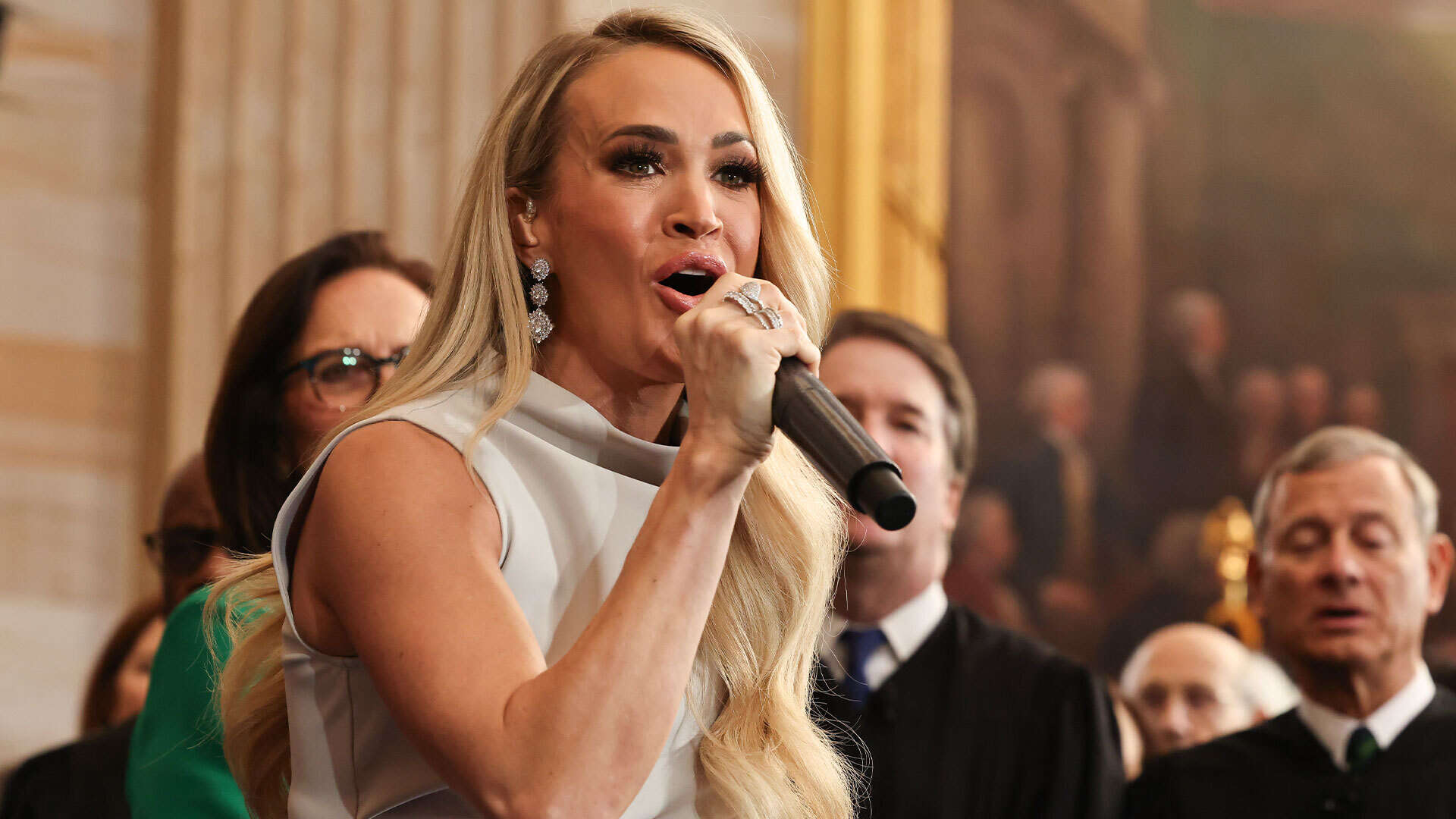 Carrie Underwood’s son Isaiah, 9, and husband Mike Fisher make rare appearance after her performance at inauguration