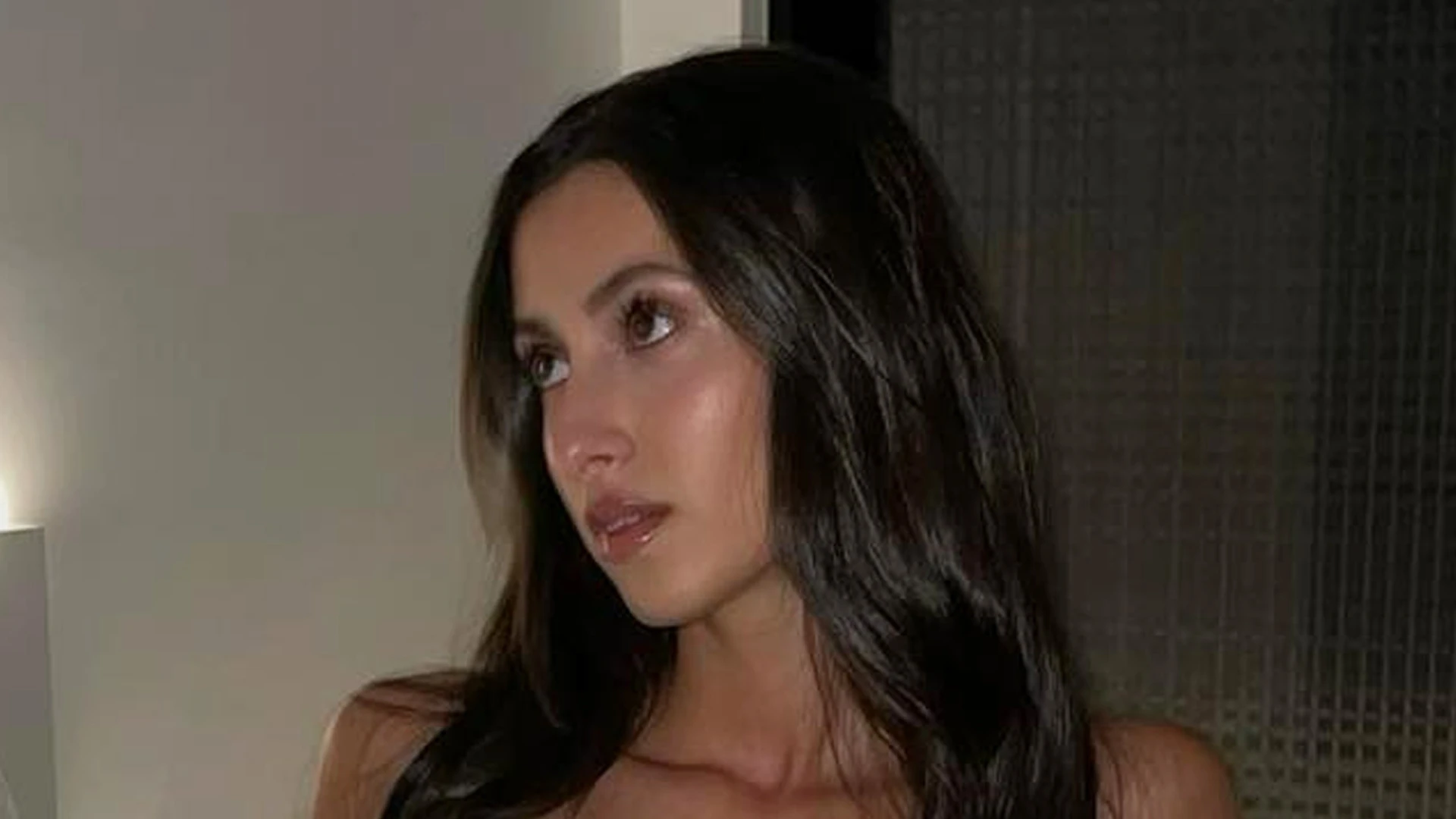 Bianca Censori’s lookalike sister Angelina wears cut-out crop top in moody selfies as dad shares concern for star