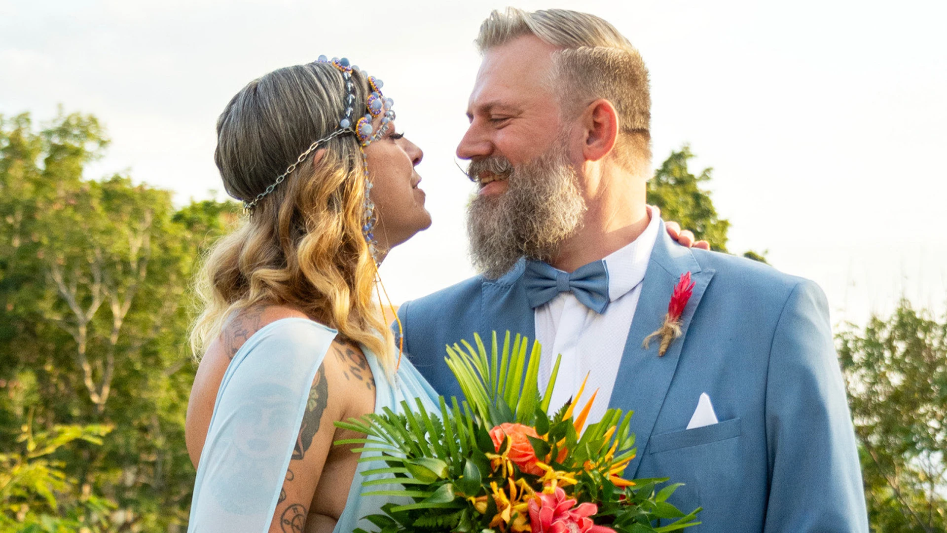 American Pickers’ Danielle Colby leans back for passionate kiss with new husband Jeremy in a nude dress in Puerto Rico