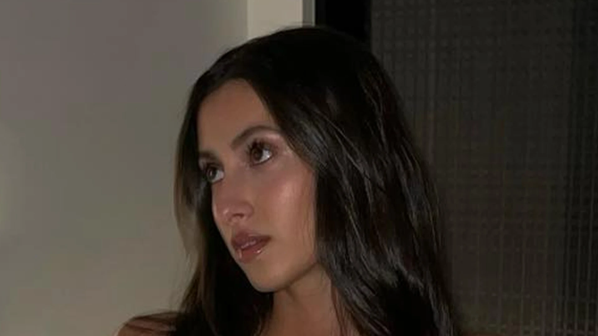 Bianca Censori’s sister Angelina channels older sibling’s risque looks as she almost slips out of tight tank in selfie