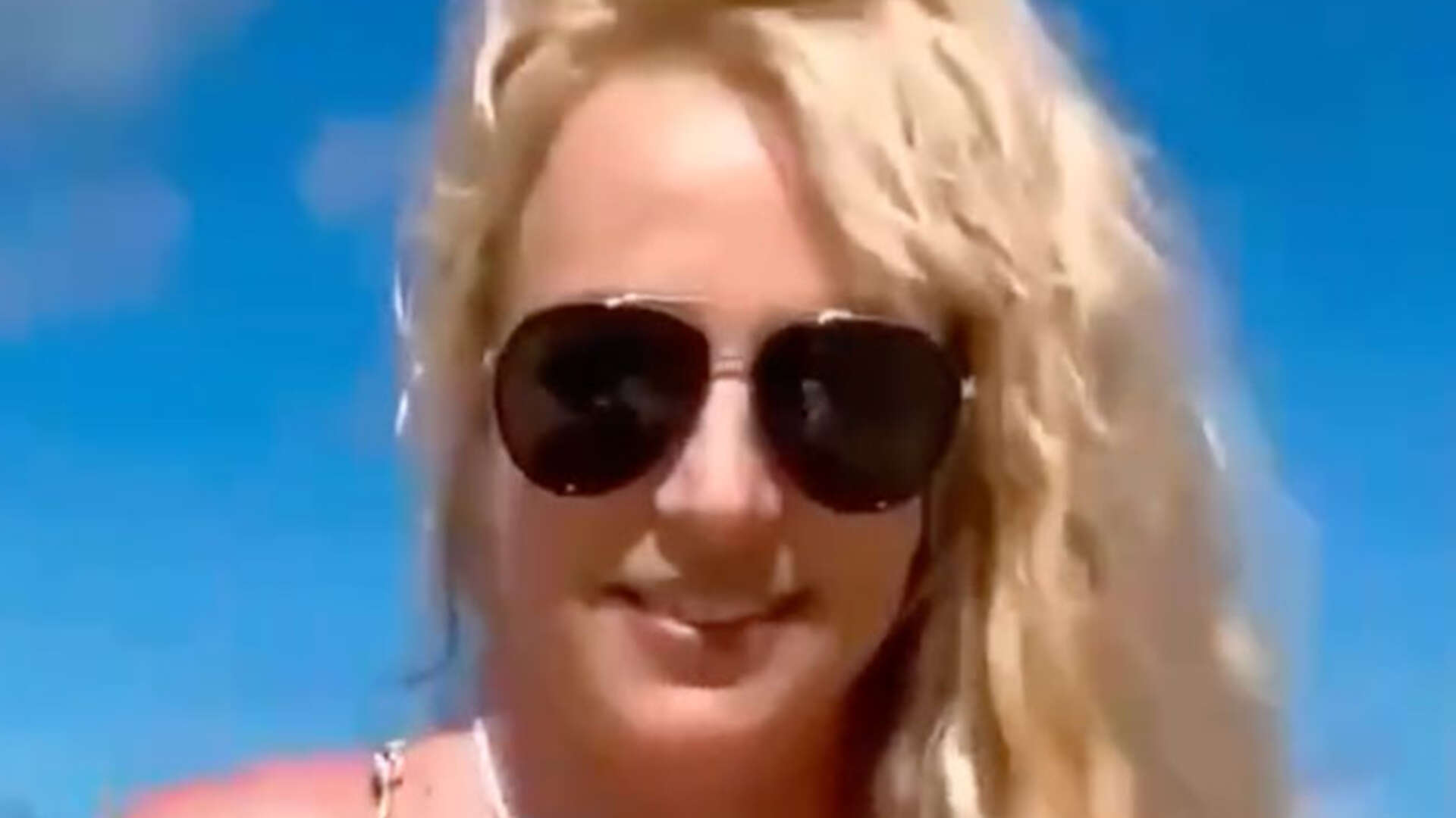 Britney Spears gets naked again on beach and admits she faced ‘struggles’ on vacation that are ‘too offensive to share’