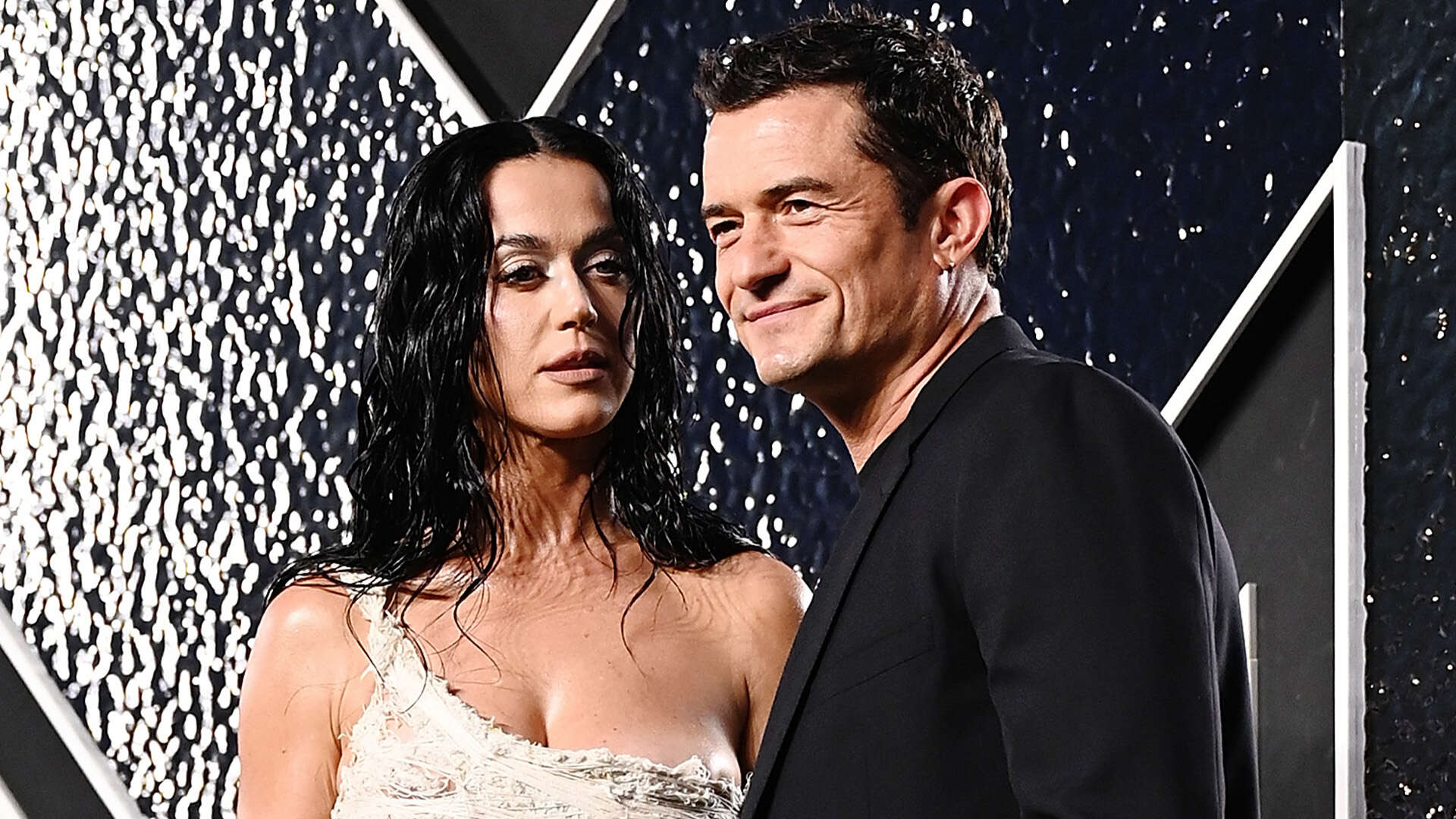 Katy Perry fans say she ‘is aging backwards’ as star shows off impressive abs at MTV VMAs with husband Orlando Bloom