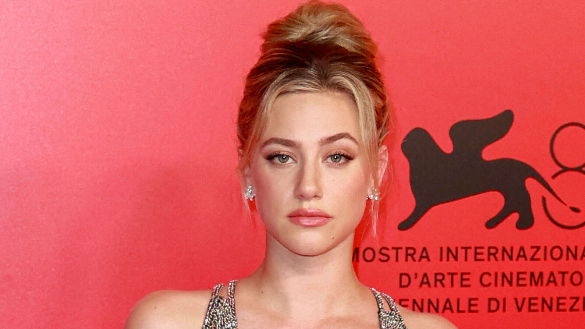 Lili Reinhart showcases new tattoo in intimate spot as she dazzles in low-cut sequin dress at Venice Film Festival party