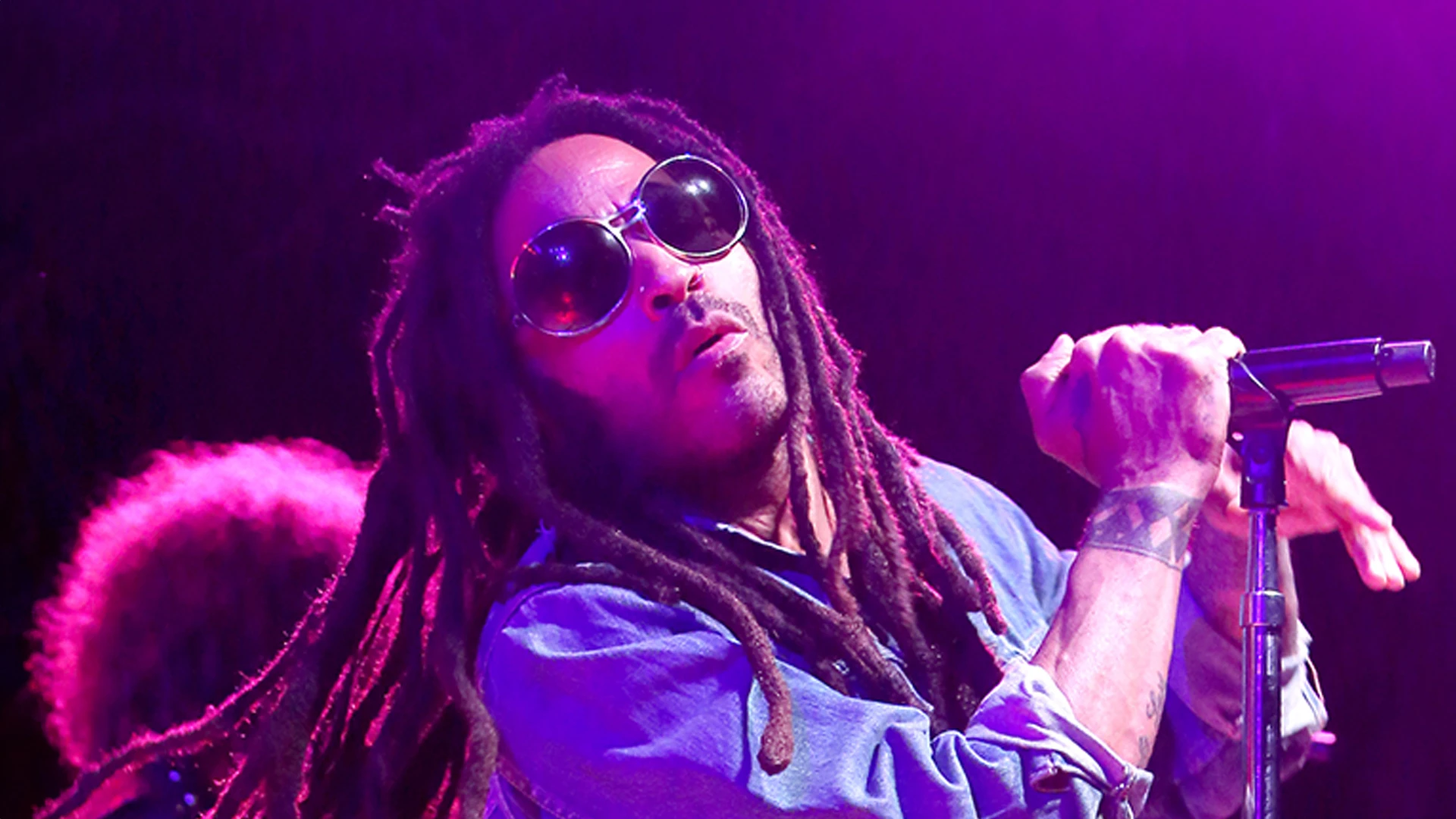 Lenny Kravitz, 60, leaves fans drooling with ‘perfect’ six-pack abs as he goes shirtless in just jeans and hair towel