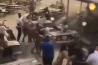 Moment brawl breaks out in pub garden as punters punch and kick each other