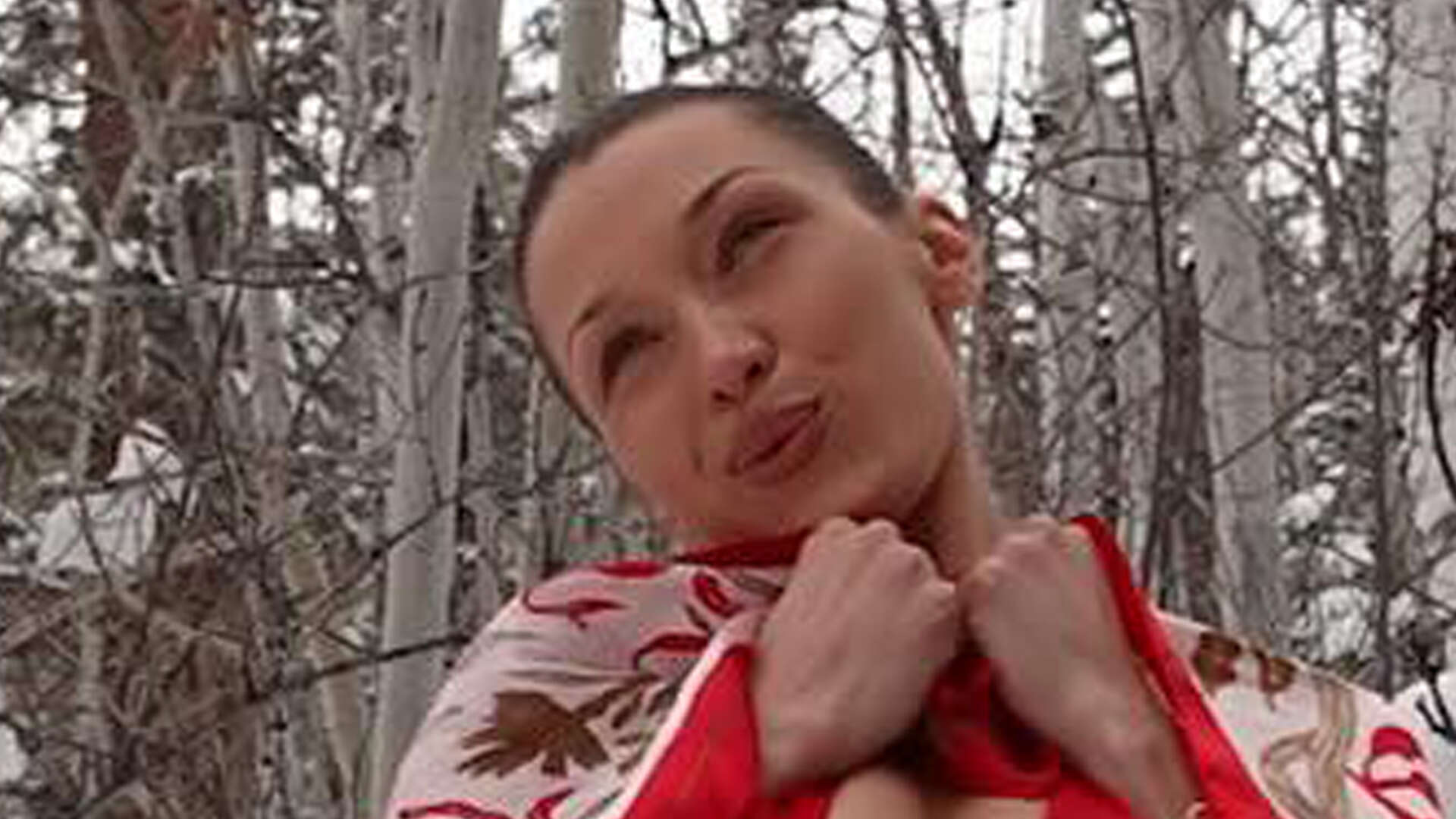 Bella Hadid rocks just a tiny red bikini and cowboy boots as she rolls in the snow for sexy photoshoot