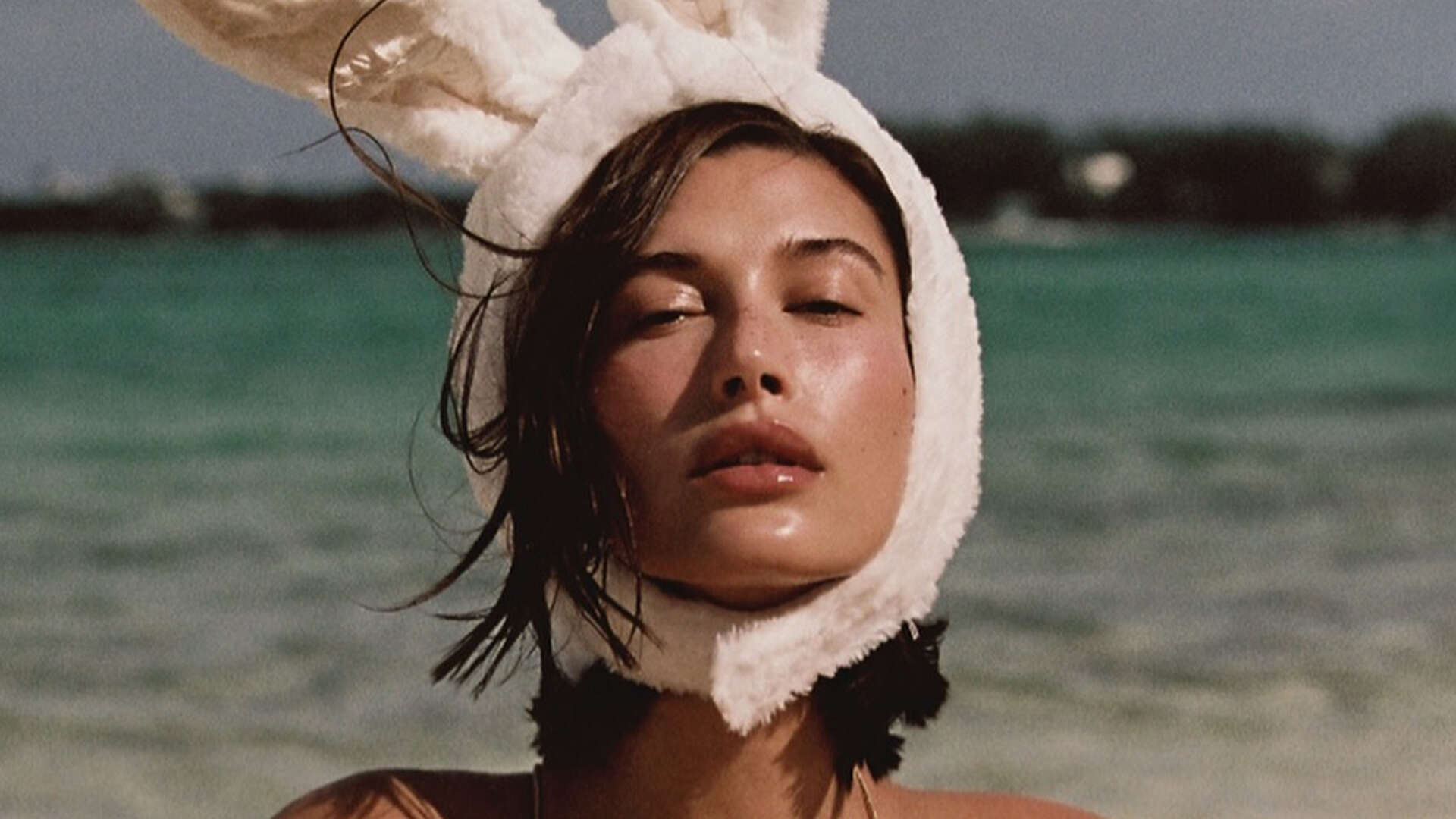 Hailey Bieber shows off slim figure in revealing black bathing suit and bunny ears on Easter without Justin