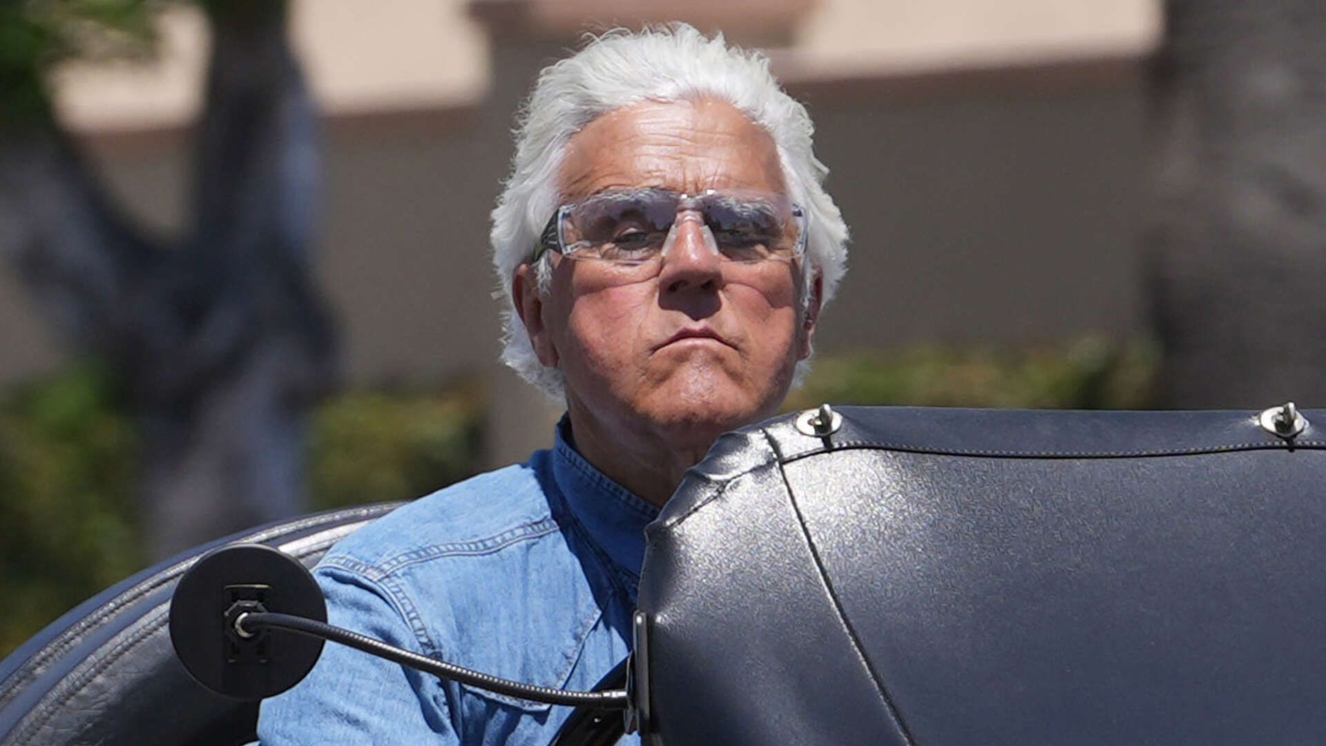 Jay Leno looks relaxed as he’s seen driving around Los Angeles in rare 1912 Stanley Roadster valued at 100k