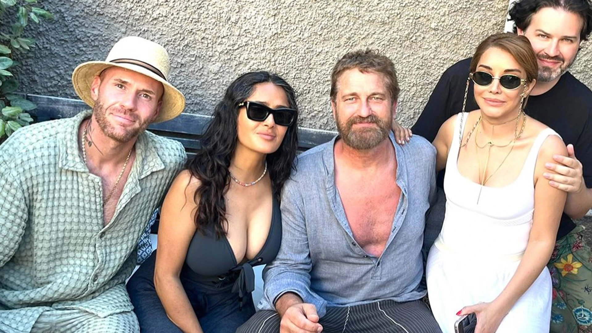 Gerard Butler fans gush over ‘handsome’ bare-chested actor as he has full beard in ‘unexpected’ run-in with Salma Hayek