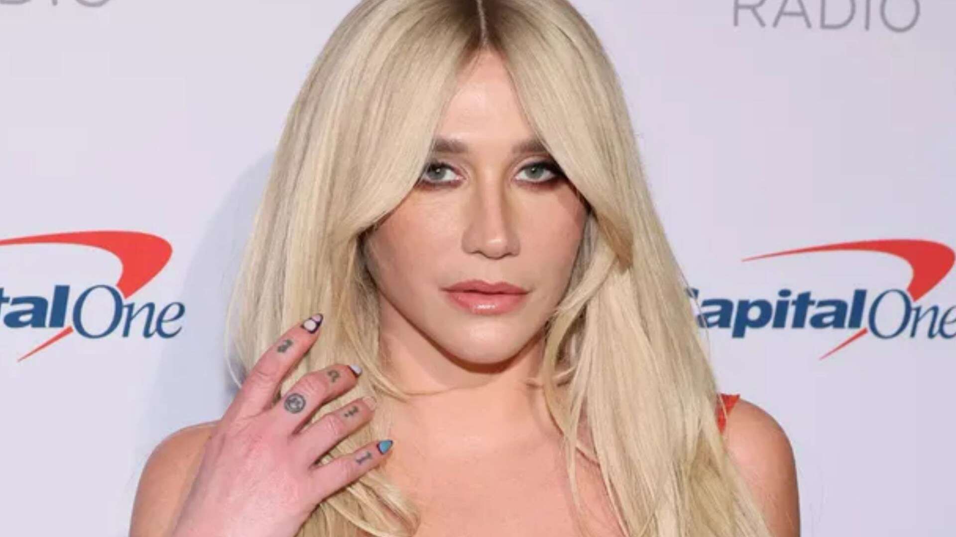 Kesha looks just like A-list star, fans say as she unveils dramatic new look in red minidress at Jingle Ball