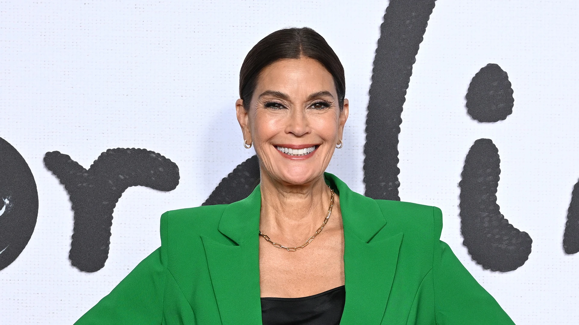 Teri Hatcher, 59, hits the beach on Corsica getaway in lace-up black swimsuit and reveals she’s ‘falling in love’