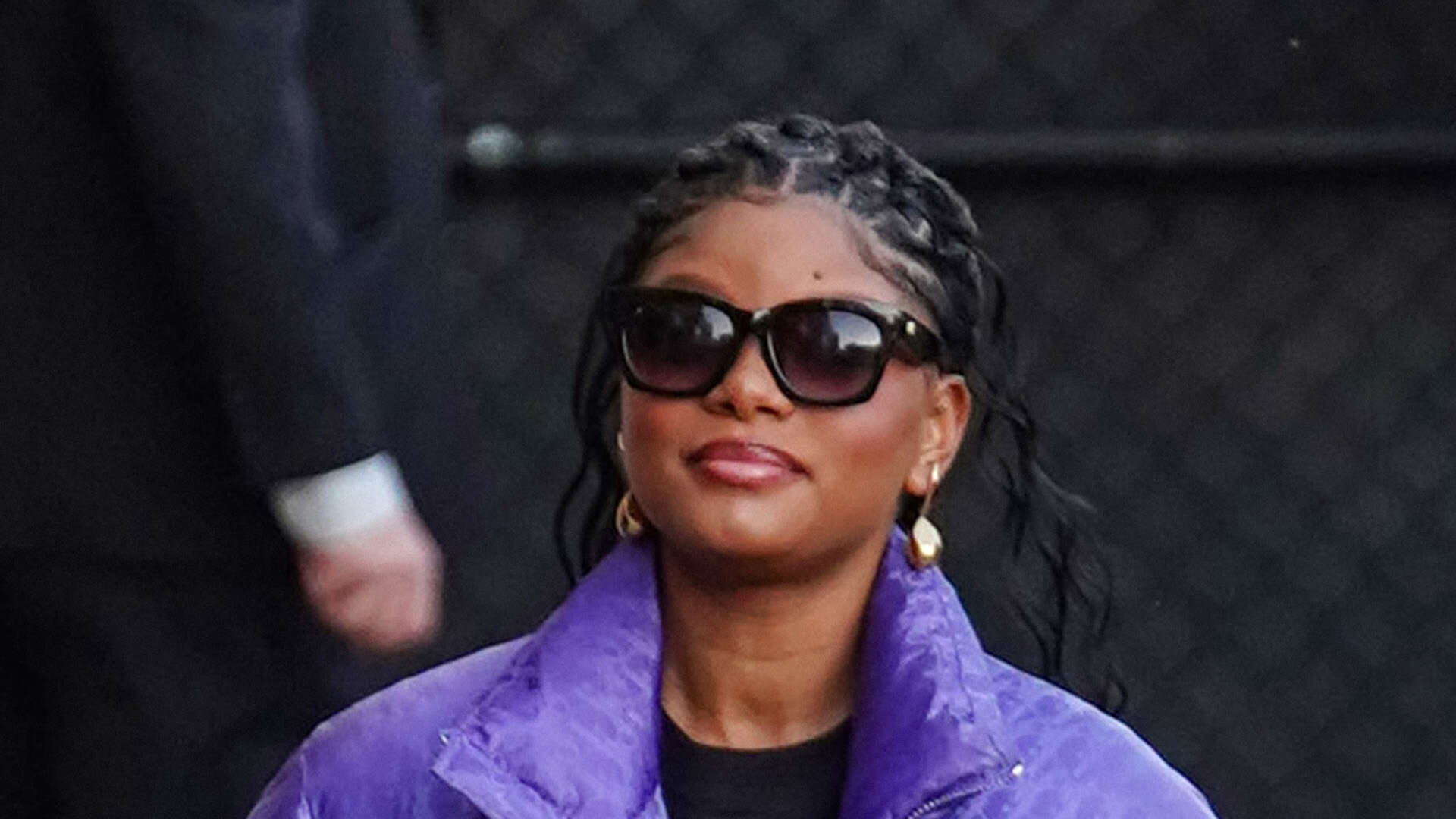 Halle Bailey covers up stomach with her arms and massive puffer as she and DDG sit courtside in LA amid pregnancy rumors