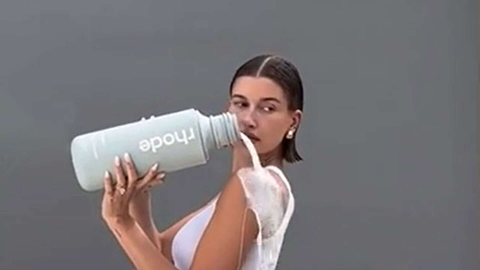 Hailey Bieber shares ‘thirst trap’ video as she pours milk all over herself in tighty whities underwear for Rhode ad