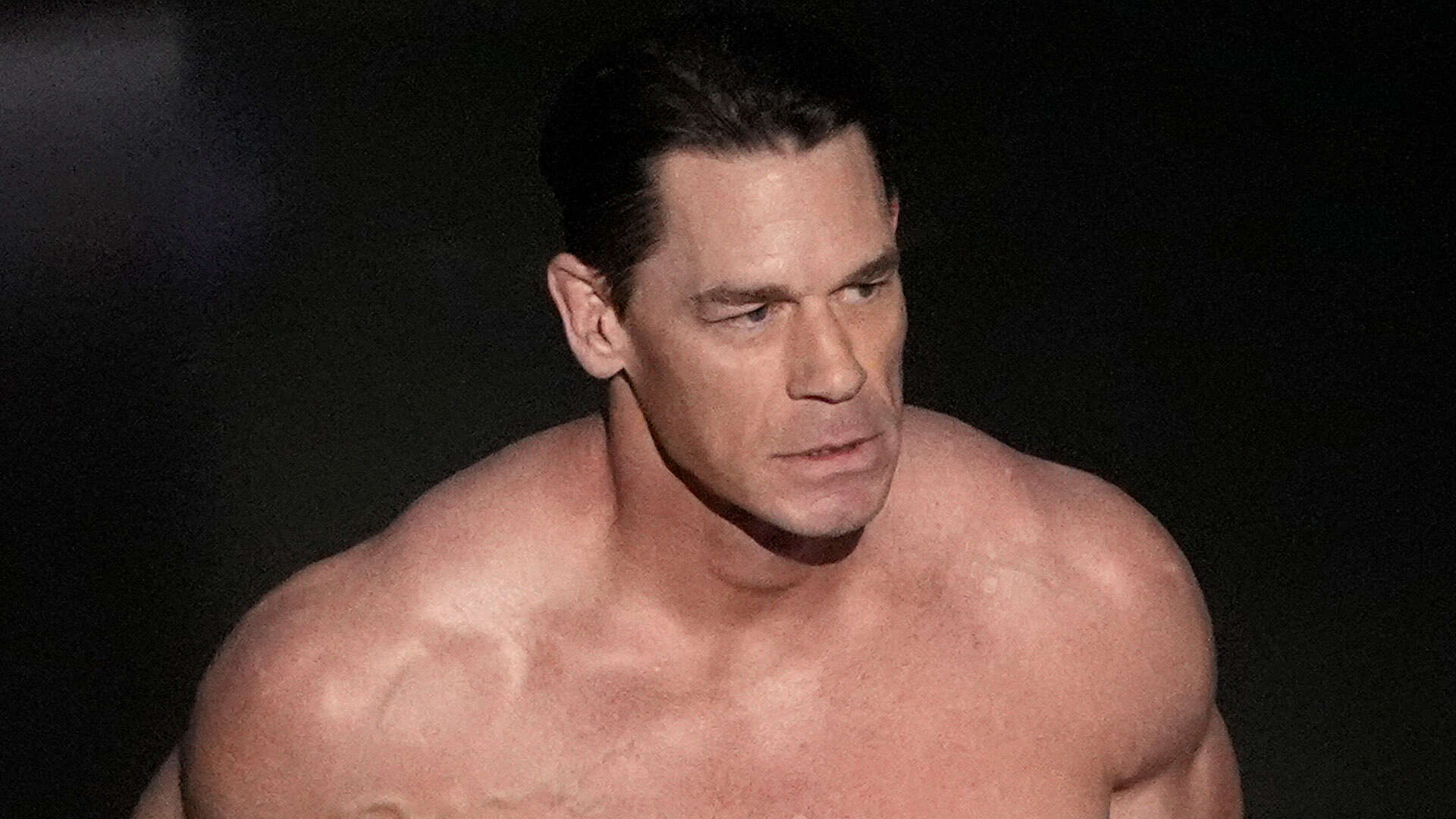 John Cena goes totally naked on Oscars stage & covers up with just a card in bizarre streaking moment with Jimmy Kimmel