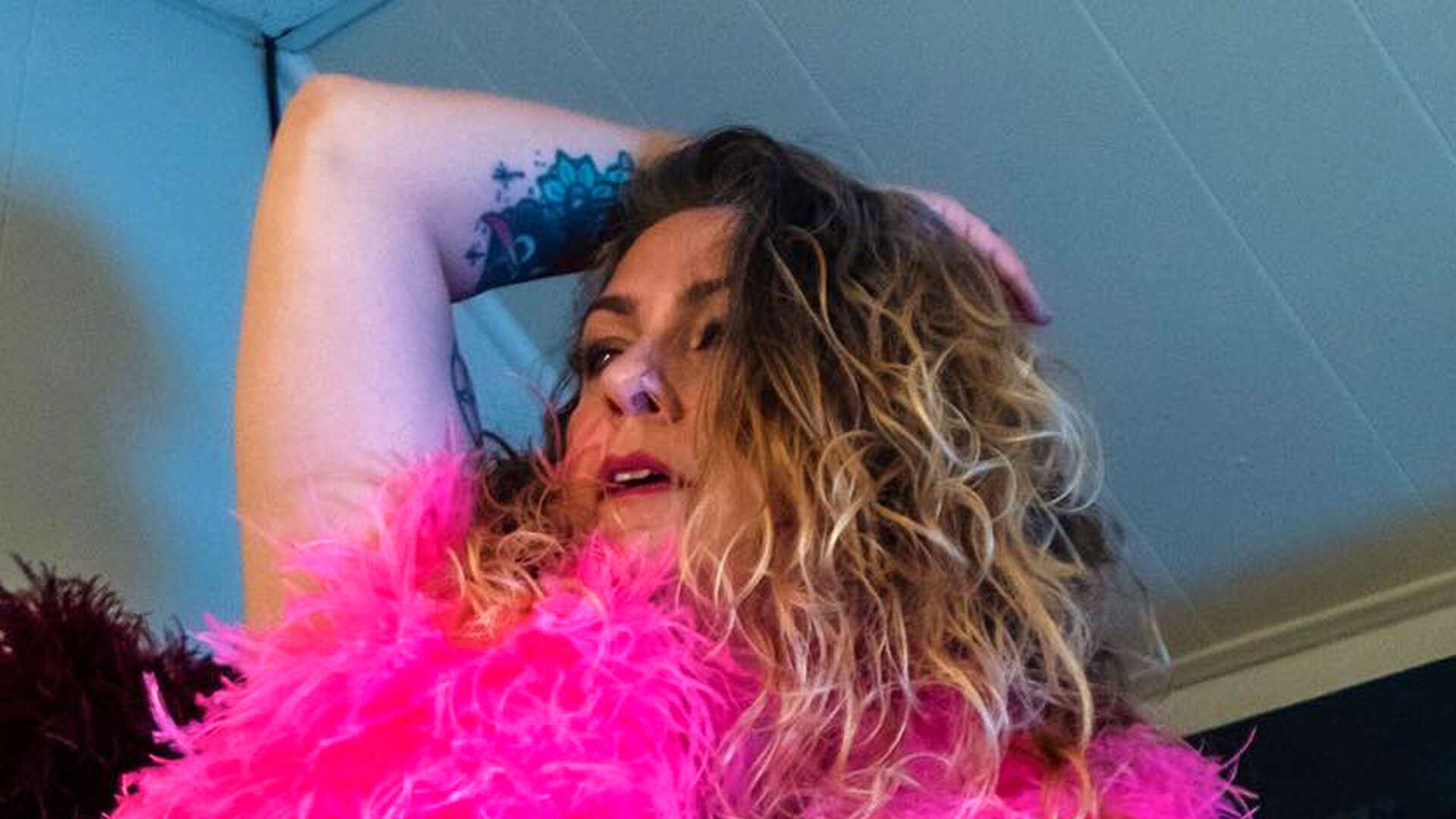 American Pickers’ Danielle Colby covers naked body in just a neon feather boa as fans cheer on ‘sexy and inspiring’ star