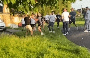 Moment boozers throw bottles at each other after man 'urinated on grave stone'