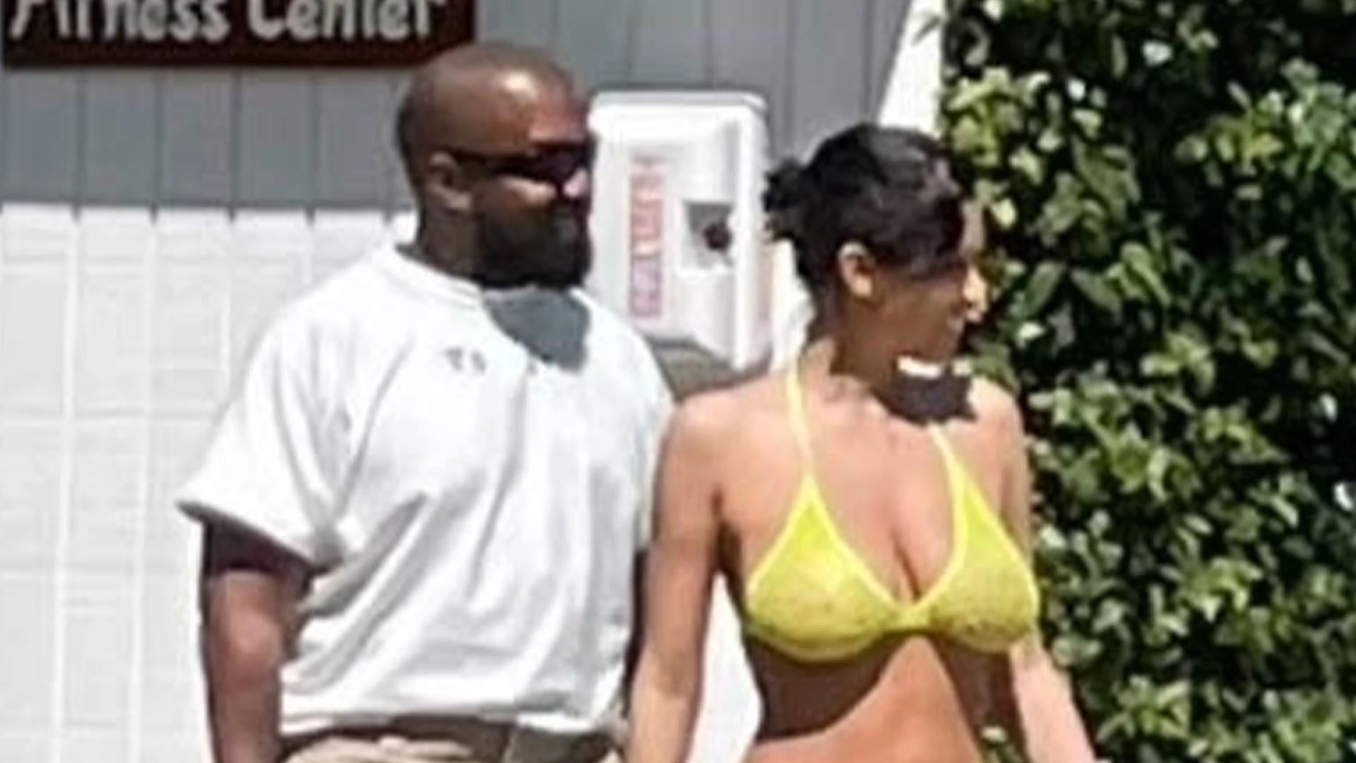 Bianca Censori wears teeny bikini and high heels while Kanye West covers up as couple head to pool at California hotel