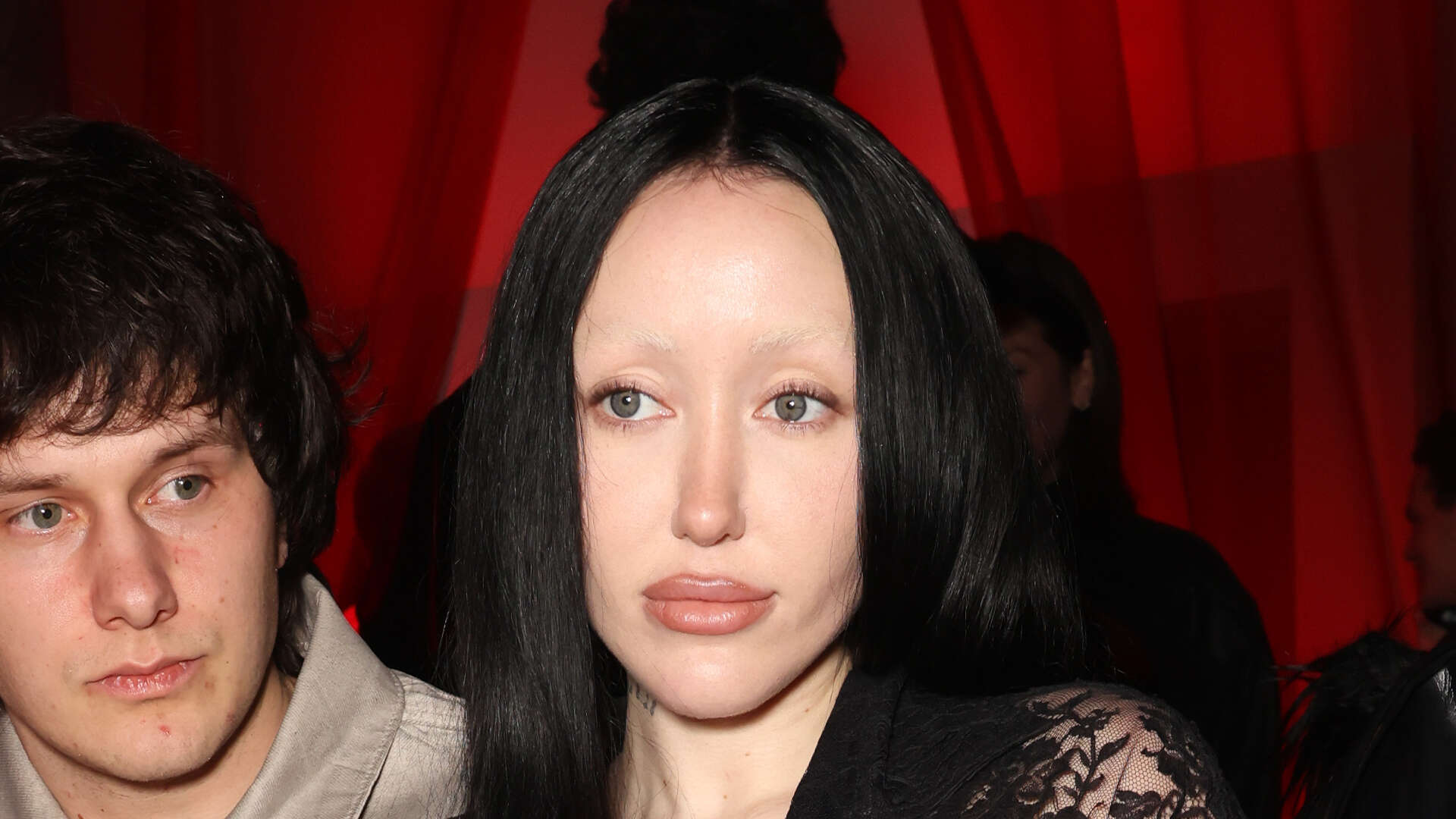 Noah Cyrus rocks see-through lace pantsuit & no eyebrows at Paris Fashion Week after news her mom ‘stole her boyfriend’