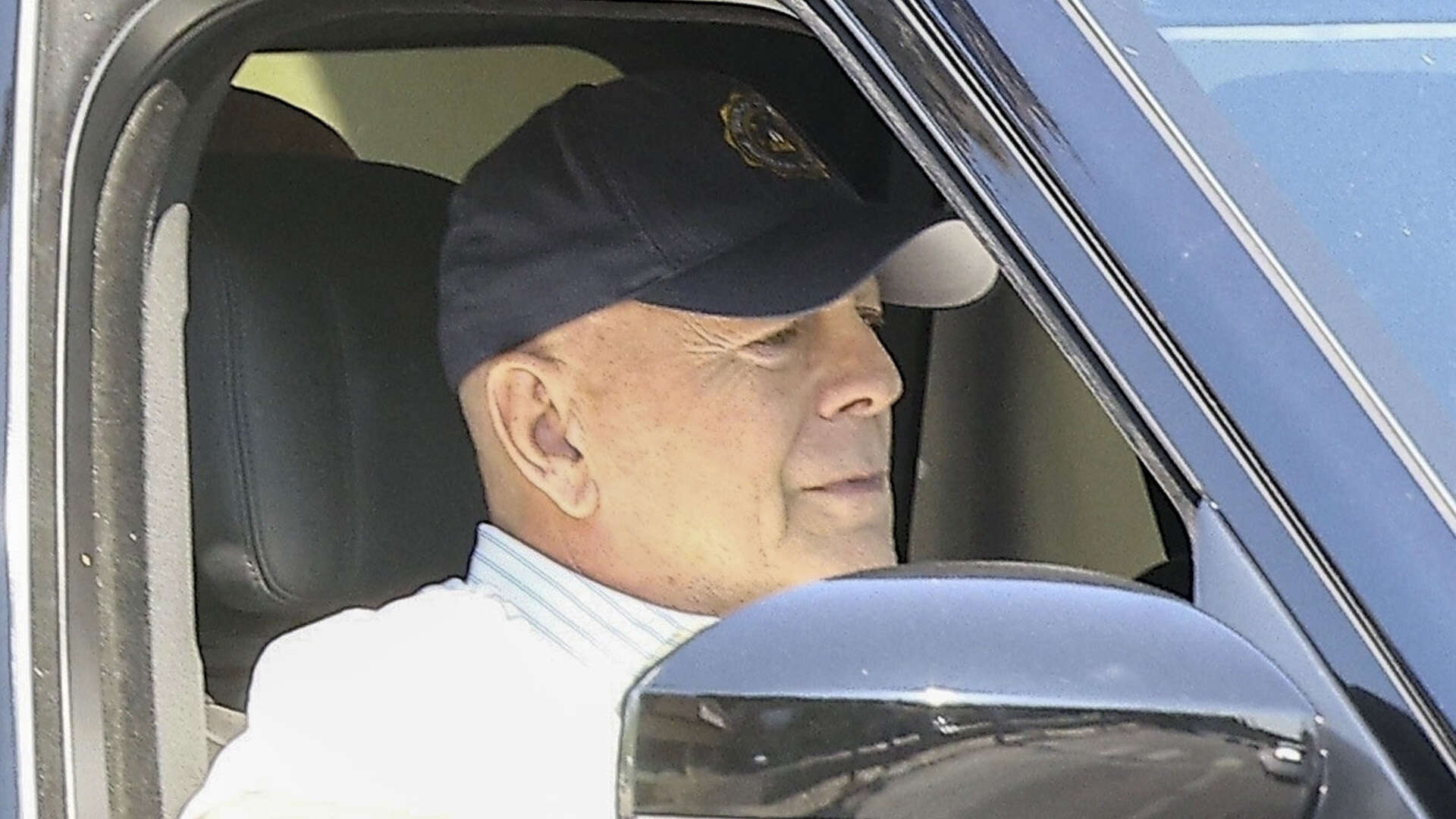 Bruce Willis, 69, makes rare public appearance with bodyguards as he puts on brave face during dementia battle