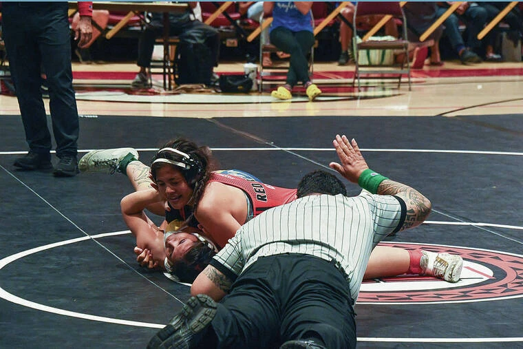 Moanalua girls celebrate team title in state wrestling; Kahuku’s Esera wins third title