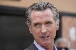 California governor signs orders to roll back coronavirus rules