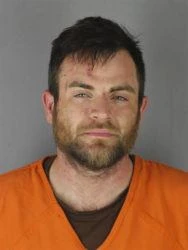 Man who drove at Minneapolis protesters charged with murder