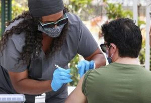 U.S. hits encouraging milestones on coronavirus deaths and shots