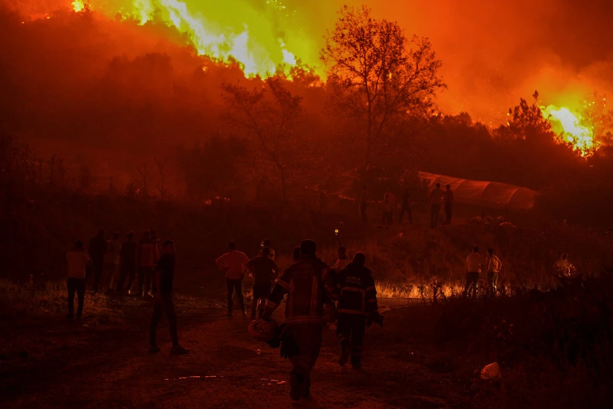 Turkey wildfires hit fourth largest city in record 50C heatwave