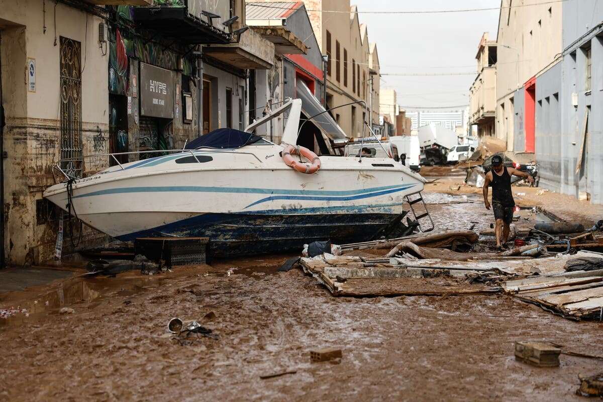 What caused the devastating flash flooding in Spain?