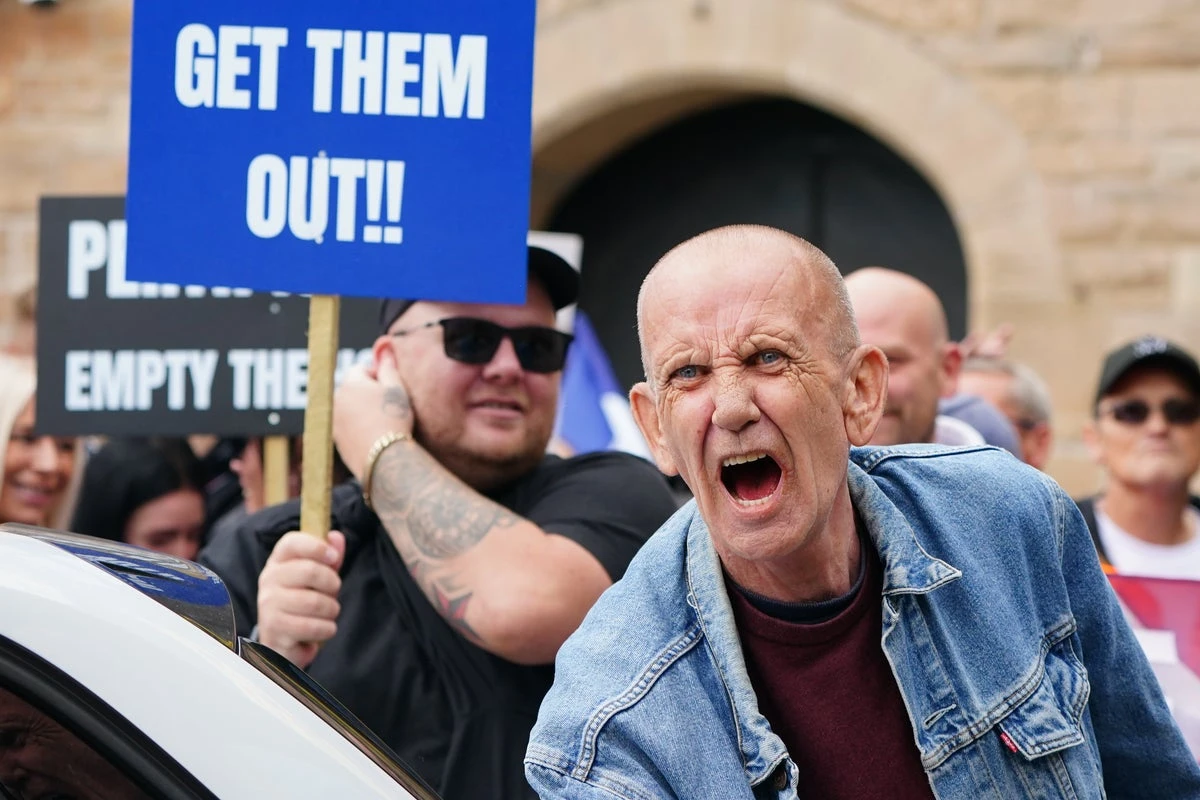 Protesters clash outside hotels amid rising tensions over asylum