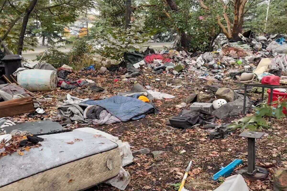 Shooting near a homeless camp leads to discovery of body in a suitcase