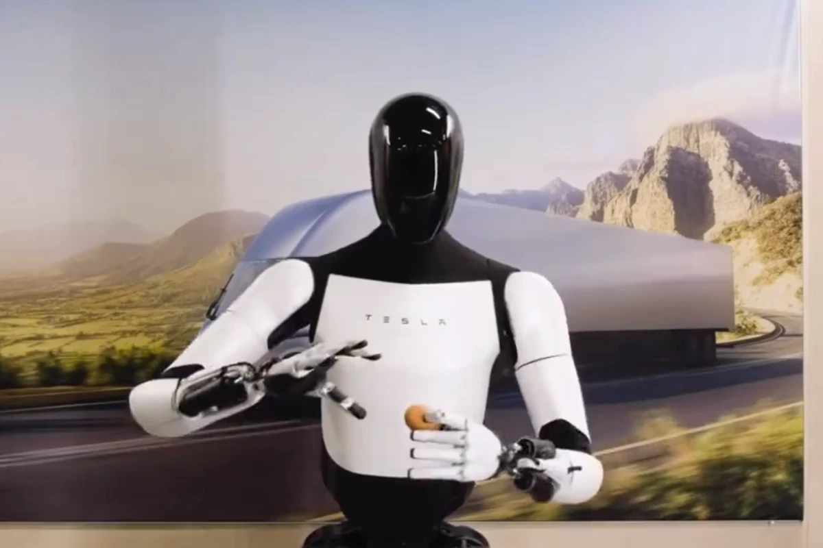 Tesla shows off new Optimus robot poaching an egg