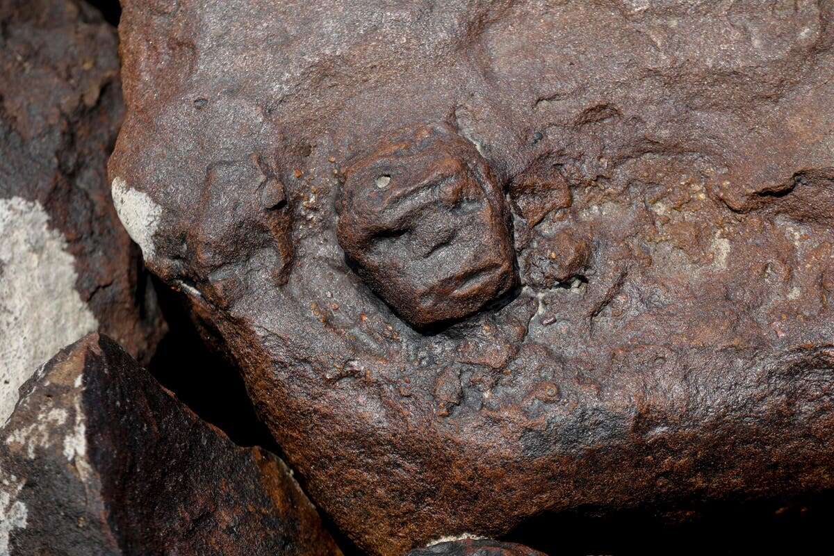 Strange ancient ‘human face’ rock carvings revealed by receding waters