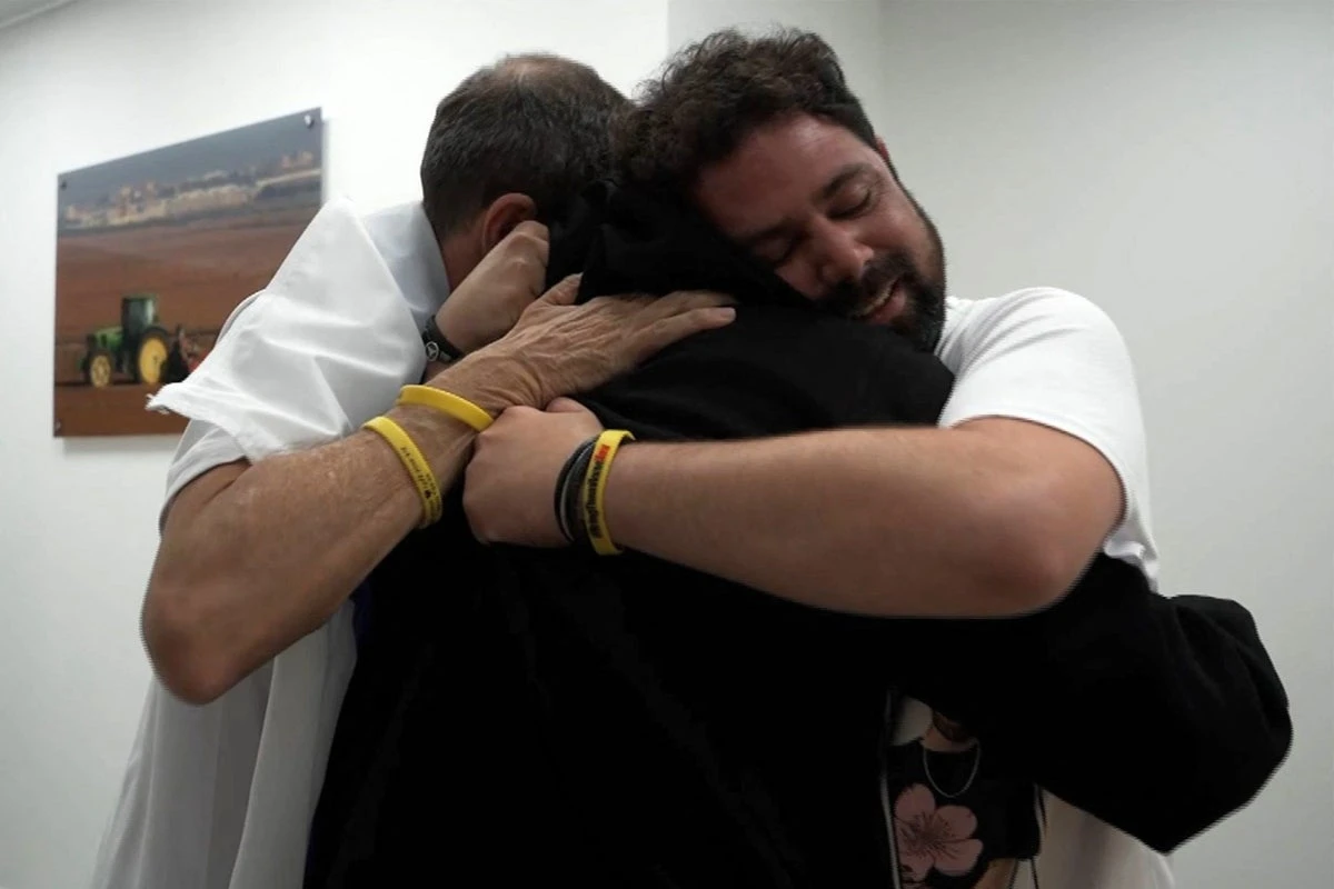 ‘How long we dreamed of this day’: hugs and tears as loved ones freed