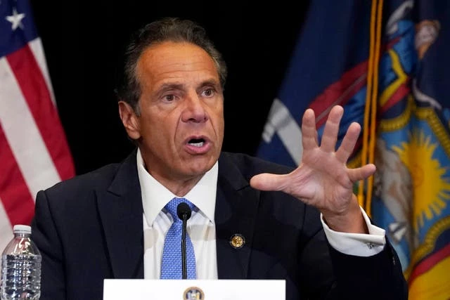 Cuomo pictured in poolside crisis meeting as New Yorkers demand he go