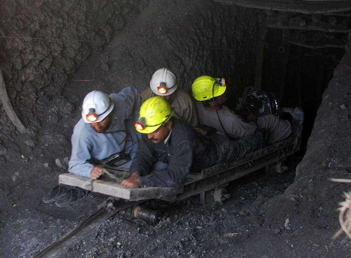 Rescuers race to save 12 workers after gas explosion in coal mine