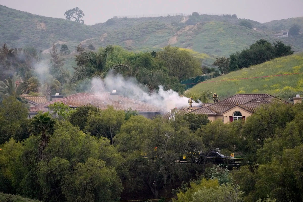 Pilot killed as small plane crashes into homes in California