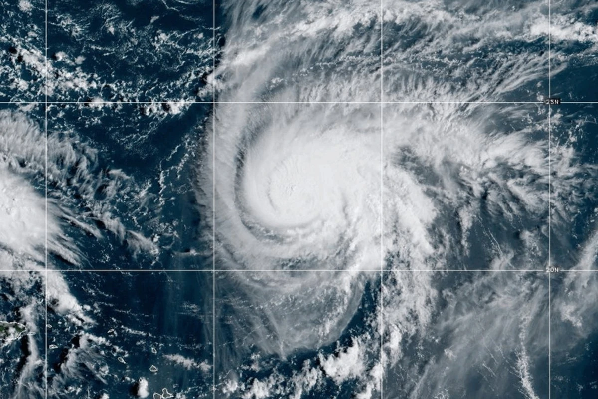 Two tropical storm systems near each other could wind up shielding the Carolinas from damage