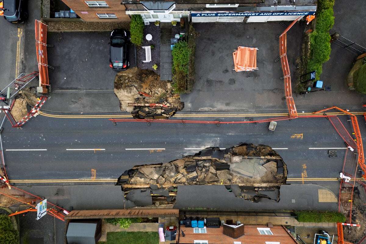 Defiant grandfather on Surrey sinkhole street refuses to leave home