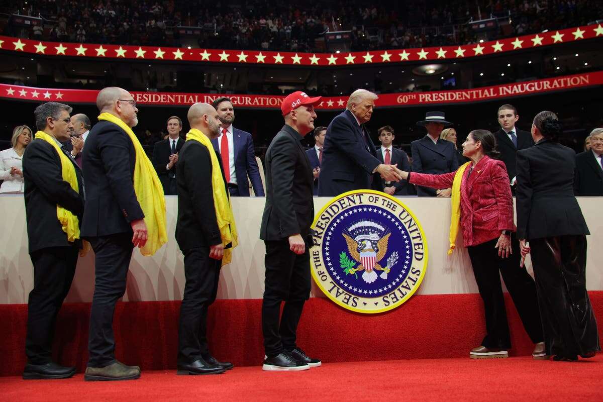 Families of Israel hostages meet Trump as surprise guests at arena