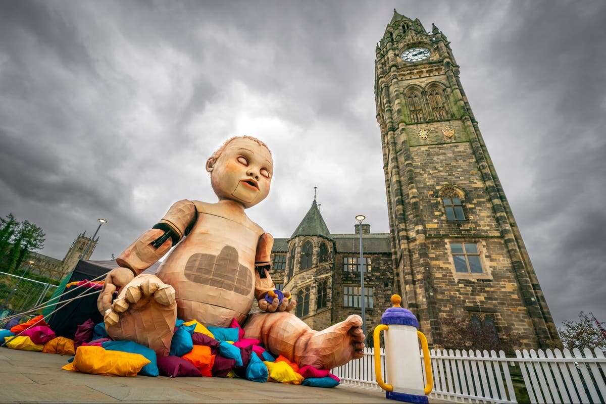 Locals shocked by arrival of giant “creepy” baby figure in town centre