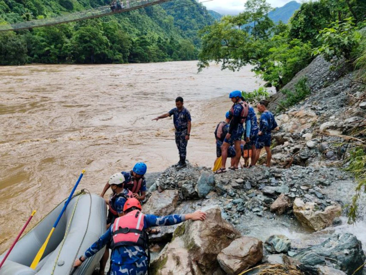 60 missing in Nepal after landslides sweeps buses into swollen river