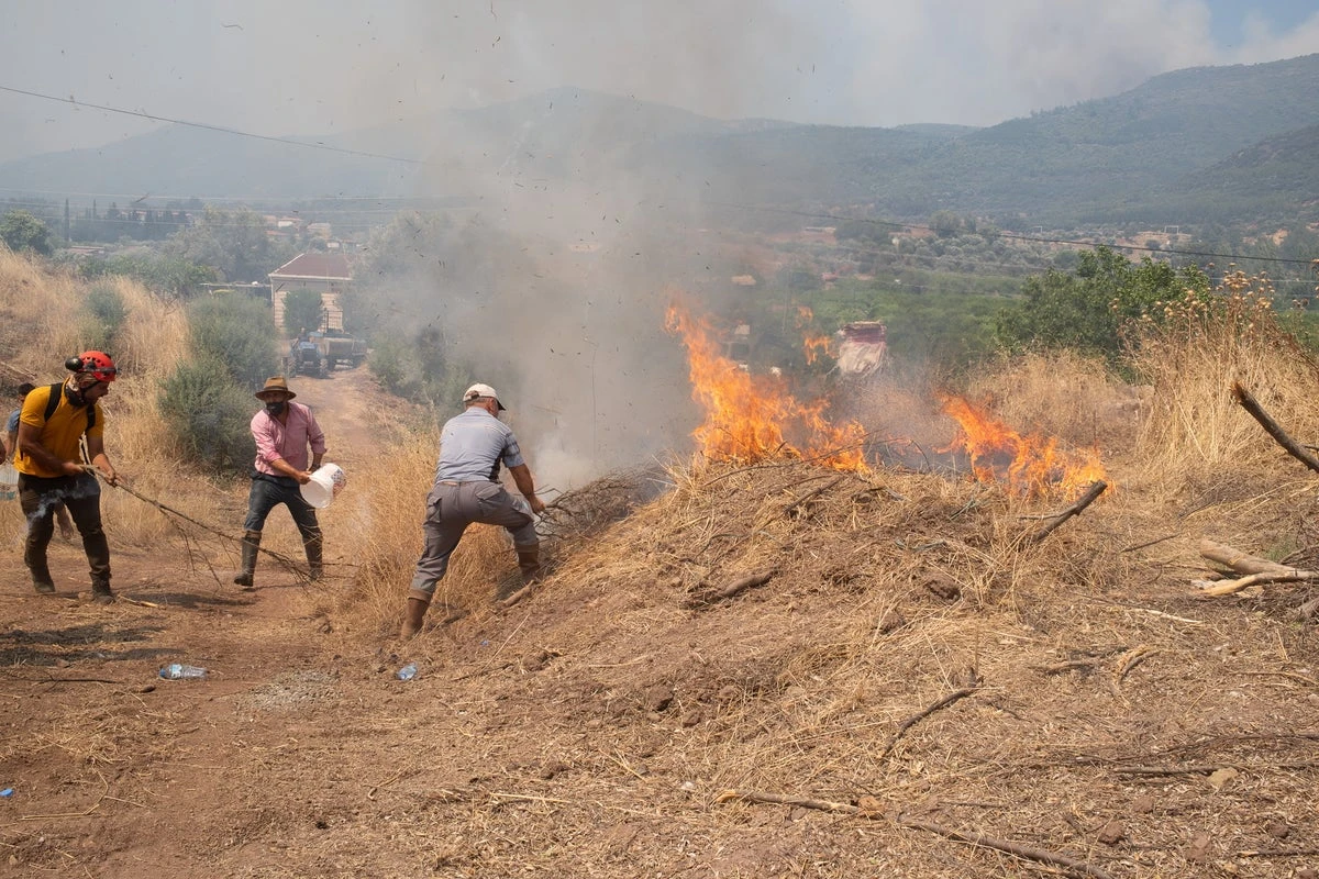Spain set for hottest June on record as 50,000 flee Turkey wildfires