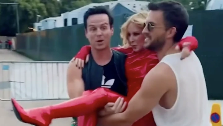 Kylie Minogue carried to BST stage by Andrew Scott and Jonathan Bailey