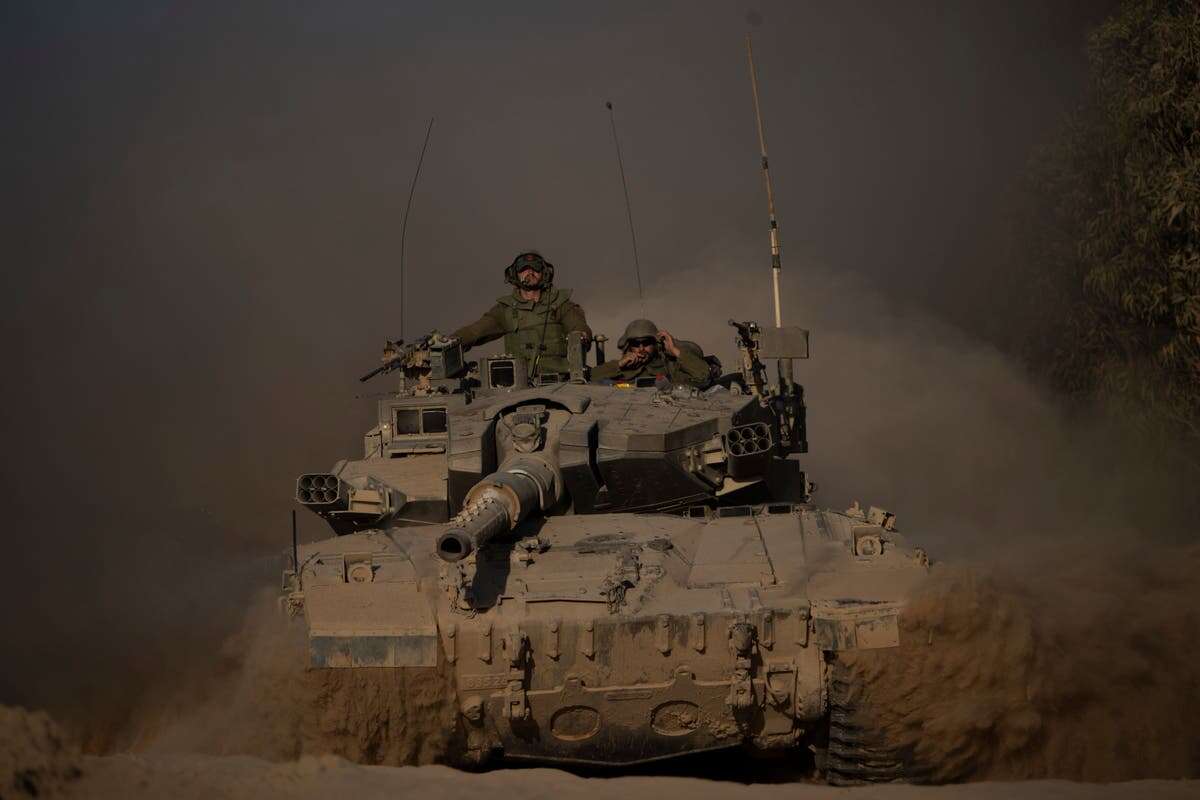 Israeli tanks roll deeper into Gaza City as residents flee